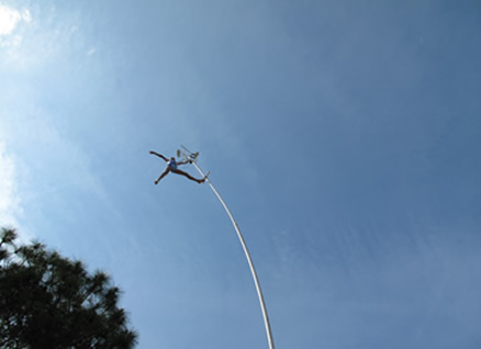 Ten-year-old Briana Phelps practices atop the 50-foot swaypole