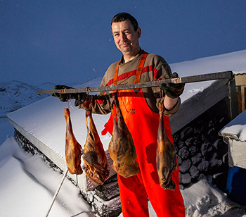 Icelandic man with drying fish