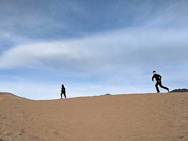 Runner on sand dune