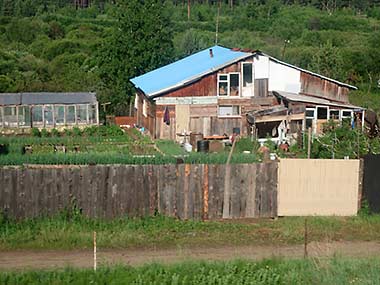 Trans-Siberian Railway view of homes and gardens