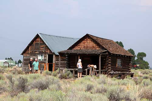 Fort Rock Museum visitors explore the Homestead Village