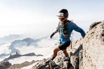 Jason Hardrath balancing on ridge rocks