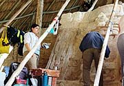 Lourdes Navarrete with co-workers doing conservation work at Kohunlich and these same two masks in 2006