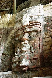 Lourdes Navarrete with co-workers doing conservation work at Kohunlich and these same two masks in 2006